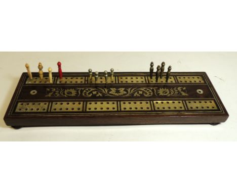 A 19th Century rosewood cribbage marker board with mother of pearl panels and foliate decoration on four ball supports and wi