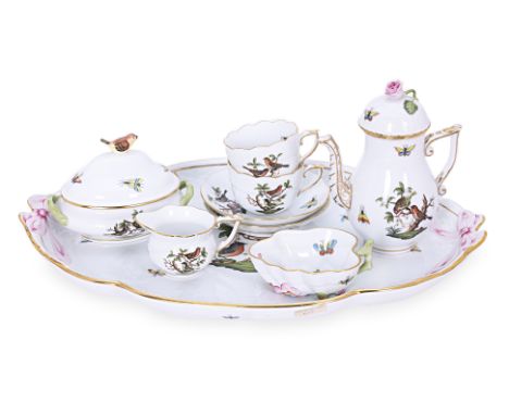 A HEREND ROTHSCHILD BIRDS TETE A TETE COFFEE SERVICE
Nine pieces, hand painted pairs of birds, winged insects and gilt decora