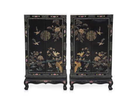 A PAIR OF LACQUER AND STONE INSET CABINETS
Black lacquered hardwood, applied carved stone scenes of birds in garden, inset sh