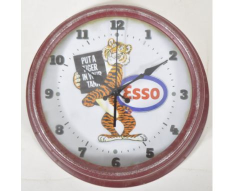 Esso - A contemporary reproduction Esso advertising station type clock having a red painted case with central tiger holding a