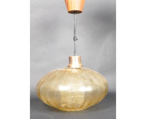 A retro vintage mid 20th Century German glass and teak ceiling light comprising of a teak and copper ceiling rose mount with 