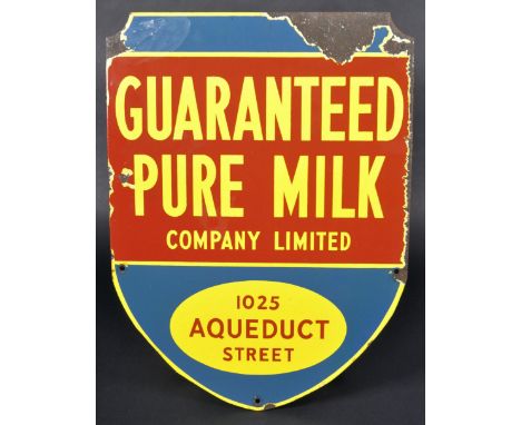 A scare mid 20th Century Canadian Guaranteed Pure Milk Company Limited advertising point of sale dairy enamel sign. The sign 