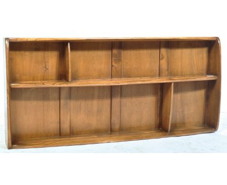 Lucian Ercolani - Ercol - A retro 20th Century 1960's beech and elm&nbsp;plate rack / bookshelf in golden dawn having three s