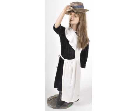 A retro vintage 20th Century shop display / fairground prop mannequin in the form of a young lady wearing a straw hat with Vi