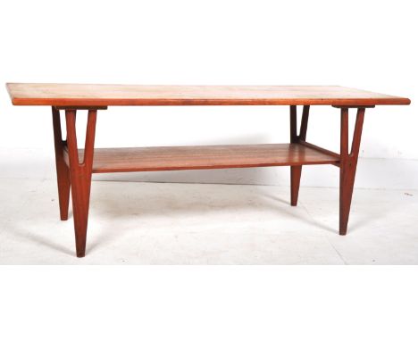 A retro mid 20th Century 1960's Danish teak wood long john coffee table of rectangular form raised on Y-framed supports unite