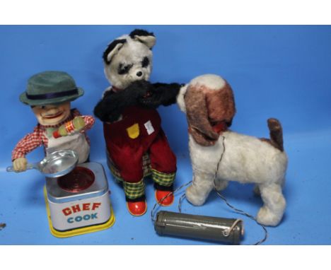 THREE 1960S JAPANESE AUTOMATON TOYS consisting of a walking dog, a chef and a balloon blowing panda  (3)