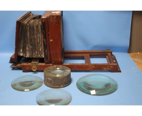 A MAHOGANY MAGIC LANTERN A/F with a tin containing a lens