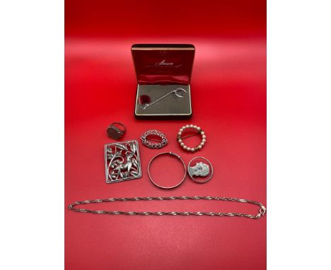 A Quantity of silver marked jewellery which includes Danecraft deer design sterling silver brooch, Silver bangle, 925 gilt si