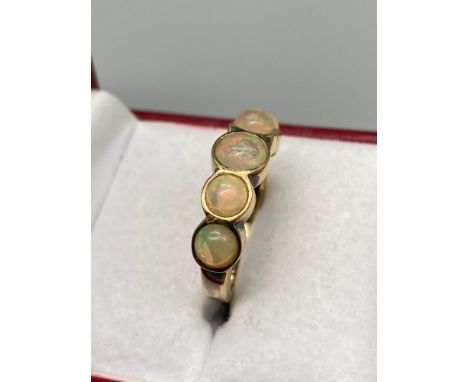 A Ladies 925 gilt silver ring set with 5 large opal style stones. [Ring size Q] 