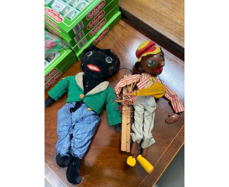 A Vintage Golly teddy together with a Pelham puppet musician figure. 