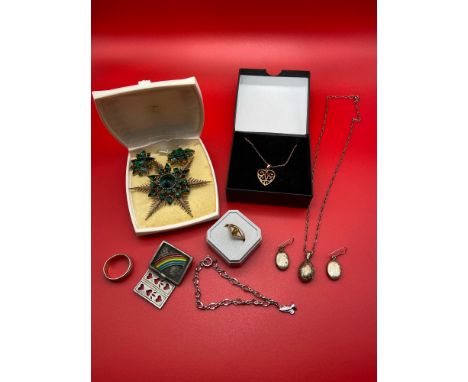 A Quantity of silver and costume jewellery. Includes Sterling silver bracelet with preying hand pendant, Silver locket and ma