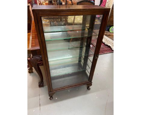 Antique Shop display cabinet designed with mirror, glass shelf and metal bracket interior. 