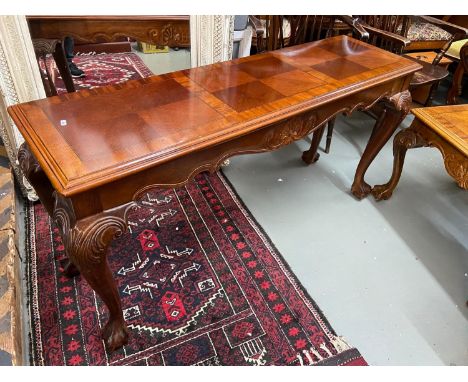 A Large hardwood console table designed with ball and claw feet supports. Together with matching side table. 