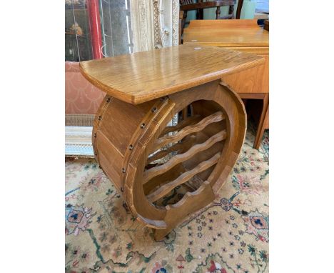 A Light oak wine table with wine storage shelving, designed to look like a barrel. [62cm height] 