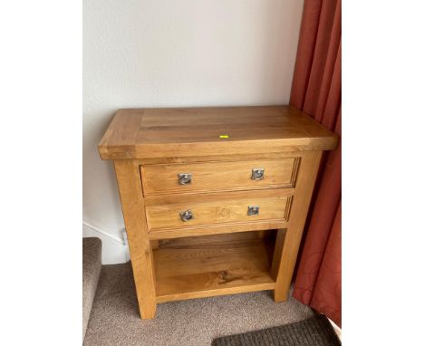 A Contemporary solid light oak two drawer console table. 