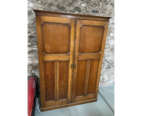 Antique solid oak travel wardrobe, fitted with hangers, drawers and mirrors. Also has an interior light. Splits into 4 pieces