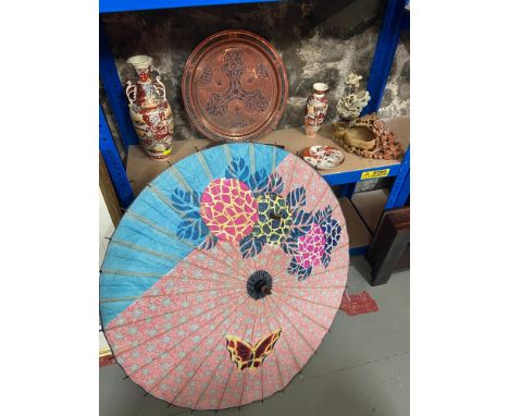 A Shelf of oriental collectables which includes Hand carved wooden sandal, Satsuma vases, Soapstone carvings and copper India