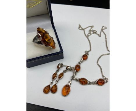 A Vintage 925 silver and amber ring, necklace and earring set. 