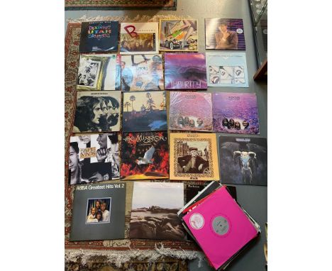 A Large collection of mixed genre records to include EAGLES, ABBA, THE MOODY BLUES, SIMPLE MINDS, HISTORY OF THE BYRDS, INXS,