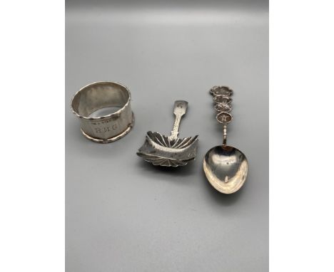 A Chinese/Japanese import silver tea spoon, Georgian silver caddy spoon and Birmingham silver napkin ring. 