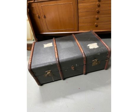 A Vintage canvas and wooden bound travel trunk. 