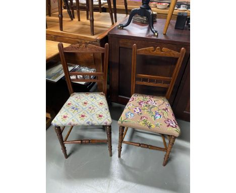 Two Victorian lounge chairs designed with tapestry seat areas. 