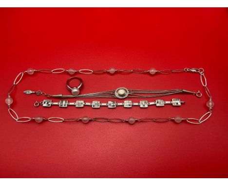 A Lot of four silver items of jewellery which includes single pearl and silver ring, Silver and mother of pearl bracelet. 