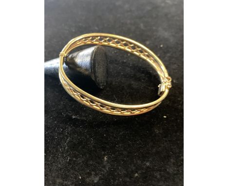 A 9ct gold bangle 12.93g 