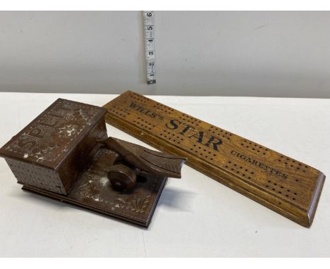 A vintage wooden novelty cigarette dispenser and a Wills cigarettes cribbage board 