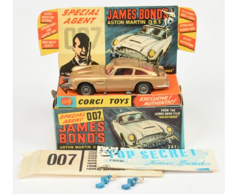 Corgi Toys 261 "James Bond" Aston Martin DB5 From "Goldfinger" - Gold body, red interior with "James Bond" figure, silver tri