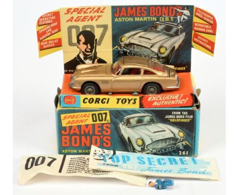 Corgi Toys 261 "James Bond" Aston Martin DB5 From "Goldfinger" - Gold body, red interior with "James Bond" figure, silver tri