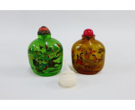 Two reverse painted glass snuff bottles, together with an early 20th century ivory lotus leaf box with a detachable top, tall