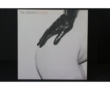 Vinyl - The Strokes Is This It on Rough Trade RTRADELP030.  Some signs of shelf wear / buffering to sleeve and a small loss t