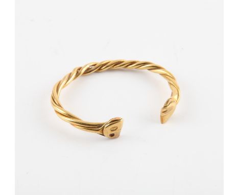 Woven bangle, a Middle Eastern twisted rope design open bangle, in tested 18 ct gold or higherCondition Report:  Gross weight