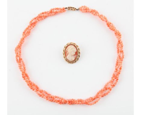 Coral necklace and cameo brooch, coral necklace has three woven strands, with light pink coral beads, with a 9 ct gold clasp,