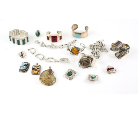 Collection of chunky silver jewellery, including a turquoise bangle, a red stone set bangle set with red stones and matching 