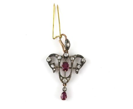Art Nouveau ruby and diamond pendant, set with a central oval cut ruby, in an openwork surround set with old cut diamonds, su