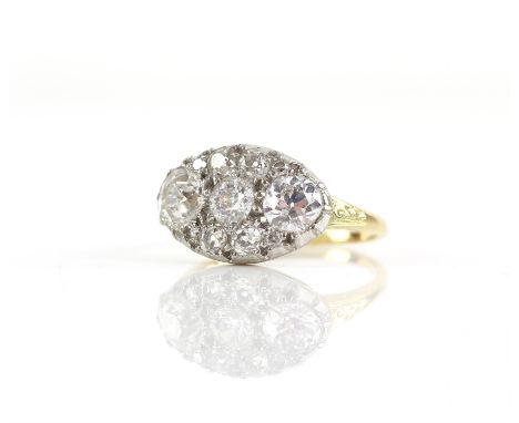 19th C diamond ring, set with eleven old mine cut diamonds, with a total estimated weight of 2.88 carats, the two largest wei