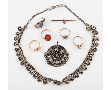 Collection of items, including three rings, one with a carnelian engraving, one set with a faux pearl and one with white and 