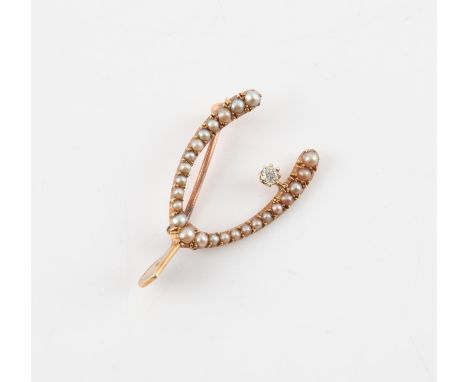 Victorian seed pearl and diamond wishbone brooch, set with an old cut diamond weighing an estimated 0.07 carat, stamped 15 ct