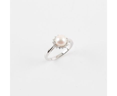 Pearl and cubic zirconia cluster ring, central 7.5mm pearl, surrounded by cubic zirconia's, claw set, mounted in stamped 9 ct