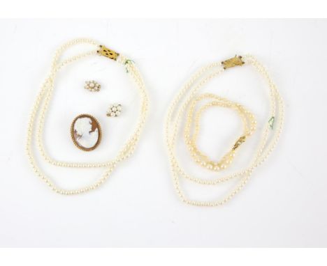 Cameo brooch and pearl necklaces, the shell cameo depicting the profile of a lady, in a 9 ct yellow gold border, a single str