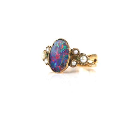 Opal doublet and pearl ring, oval opal doublet with three pearls each side, mounted in yellow metal stamped 9 ct, size NCondi