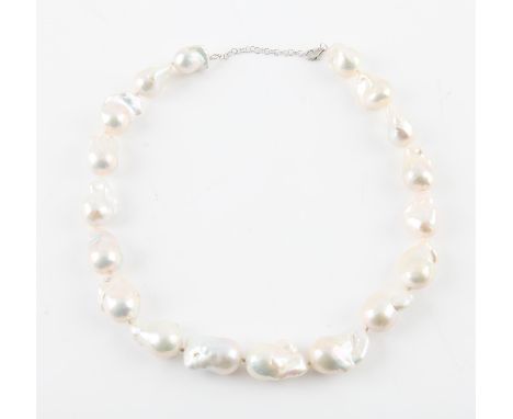 Baroque pearl necklace, set with seven-teen large white baroque pearls with a platinum clasp, length 46cmCondition Report:  I
