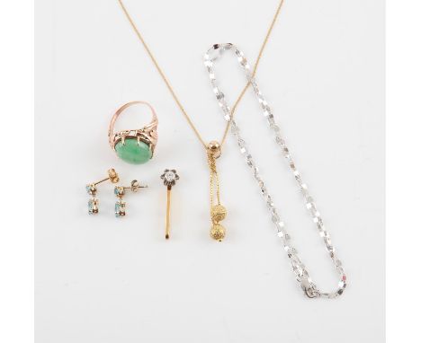 A selection of gold jewellery, including a drop pendant, set with a 0.15 carat round brilliant cut diamond, a single stone ja