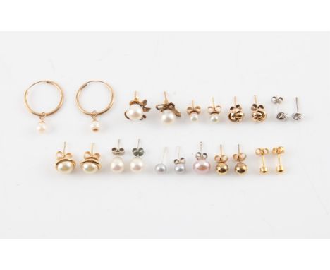 Collection of earrings, including a pair of hoop earrings with pearl drops, two pairs of pearl studs, two pairs of knot earri