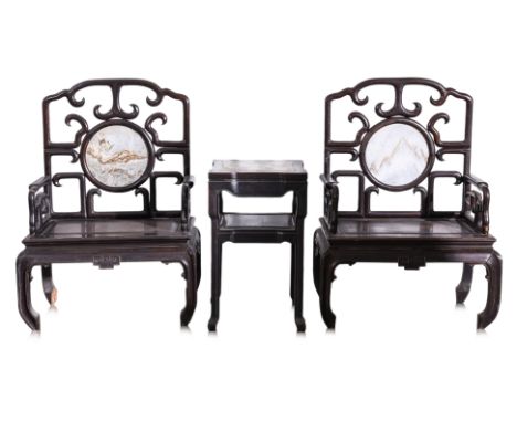 A PAIR OF LARGE MARBLE INSET HARDWOOD ARMCHAIRS AND SIDE TABLE (2) The openwok scroll decorated back rest with central circul