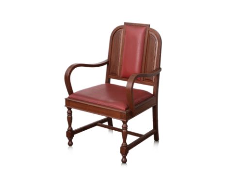 A FORMER SUPREME COURT SALON ARCMCHAIR
Circa 1970s/80s, teak wood frame with high curved armrests, red faux-leather pressed v