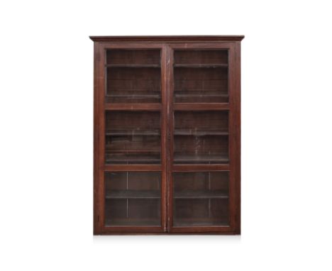 A LARGE GLAZED TEAK BOOKCASE
Early 20th Century, With a pair of panelled glazed doors enclosing adustable shelves
191 x 144 x