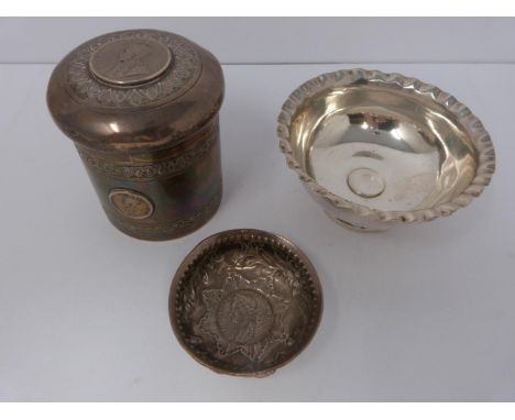 A collection of white metal dishes and a box decorated with coins and a silver and horn twist handle Toddy ladle. 